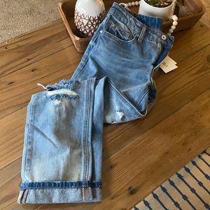 Medium wash cuffed relaxed distressed jeans